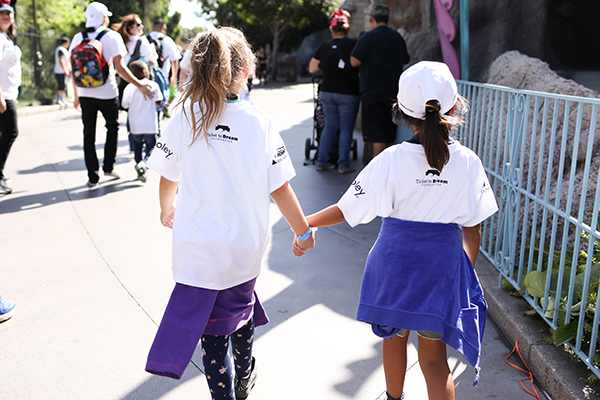 girls walking holding hands